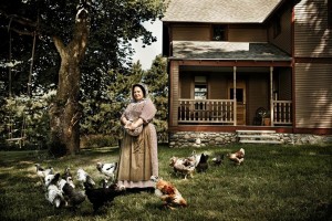 Proprietress Susan Odom feeding the chickens in the yard